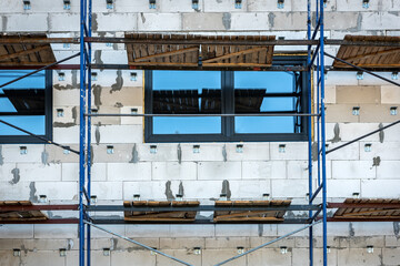 Scaffolding around a building. Renovating facade.

