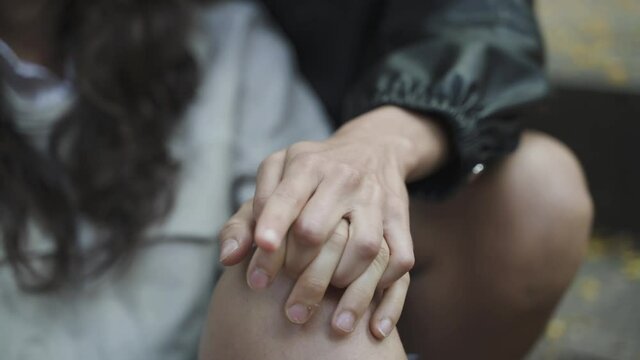 Close up of a the hands of a couple of lesbian girls. LGBT