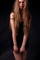 Fototapeta premium Young beautiful stylish girl posing in studio.