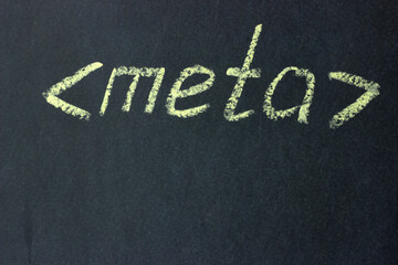 
Meta - text on a chalk board. Designation of the html code part