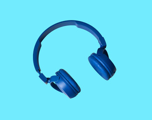 Sounds. Headphones. Accessories. Headphones on a Blue background. Blue earphones for music sound on white background. Isolated on white background. Color. Headphones for musical sound. 