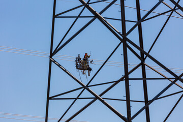 Line workers installing spacer dampers on high voltage power conductors.  Several scenes shot at each location to capture this detailed task.