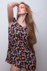 Young beautiful stylish girl posing in studio.