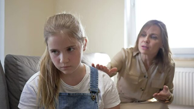 Mom is very angry with her daughter and scolds her. The girl is stubbornly silent. Difficulties in adolescence.