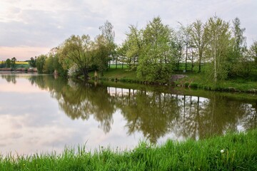 Fototapeta na wymiar Early evening by the pond. East Moravia. Czechia. Europe.