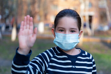 Coronavirus protection. A caucasian girl wearing protective mask