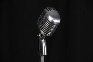Vintage microphone for singers on black background