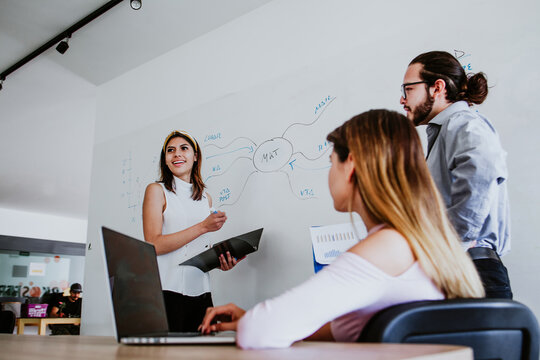 Young Latin Woman Working In At Office In A Business Meeting In Mexico Or South America