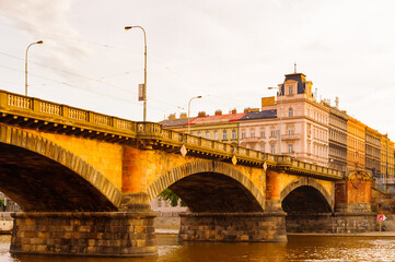 Fototapeta na wymiar Bridge over the river Vltava in Prague in the evening