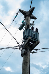 Obraz premium Pole with electric cables and telephone cables