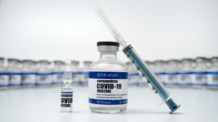 Covid-19 Corona Virus 2019-ncov vaccine vials medicine drug bottles syringe injection. Vaccination, immunization, treatment to cure Covid 19 Corona Virus infection. Healthcare And Medical concept.