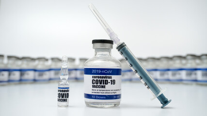 Covid-19 Corona Virus 2019-ncov vaccine vials medicine drug bottles syringe injection. Vaccination,...