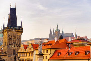 Obraz premium Tower of the Charles Bridge,and the Prague castle in Prague, Czech Republic.