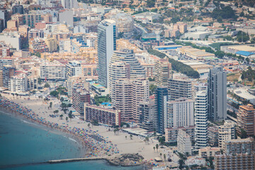 Summer view of Calpe town, Calp, with harbor and beach and Penon de Ifach mountain, Marina Alta, province of Alicante, Valencian Community, Spain