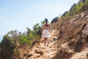 Fototapeta premium View of Calpe Calp town with Penon de Ifach mountain during the hiking to Penyal d'Ifac Natural Park, Marina Alta, province of Alicante, Valencian Community, Spain