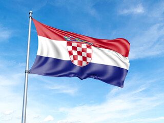 Croatia flag on a pole against a blue sky background.