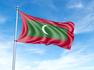 Maldives flag on a pole against a blue sky background.