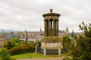 Fototapeta na wymiar Dugald Stewart Monument, Calton Hill, Edinburgh, Scotland. Old Town and New Town are a UNESCO World Heritage Site