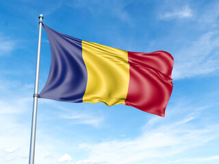 Romania flag on a pole against a blue sky background.