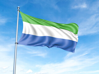 Naklejka na ściany i meble Sierra Leone flag on a pole against a blue sky background.