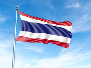 Thailand flag on a pole against a blue sky background.