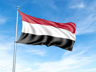 Yemen flag on a pole against a blue sky background.