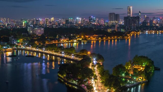 Hanoi, Vietnam, timelapse view of Hanoi skyline at dusk showing West Lake and Tay Ho District.