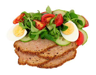 Thin slices of haslet meat with a fresh egg salad meal isolated on a white background, haslet is an English pork and herb meatloaf also sometimes called acelet