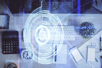 Multi exposure of data drawing hologram over topview of study desk background with computer. Concept of technology.