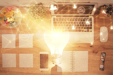 Social network hologram drawings over computer on the desktop background. Top view. Double exposure.