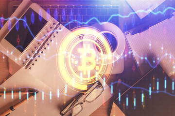 Double exposure of blockchain theme hologram over table with phone. Top view. Crypto technology...