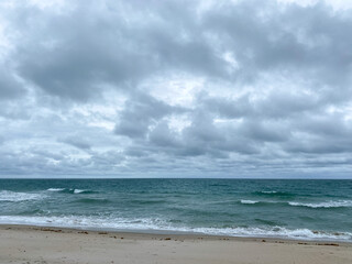 Ocean waves lapping on the beach  on a beautiful sunny day along the shoreline