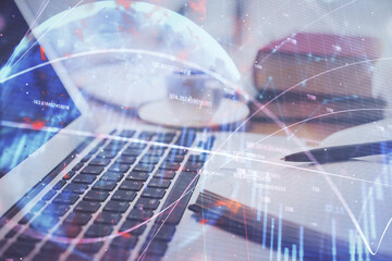 Double exposure of financial chart drawing and desktop with coffee and items on table background. Concept of forex market trading