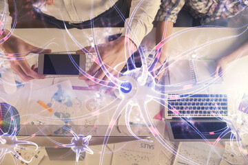 Double exposure of man and woman working together and neuron hologram drawing. Computer background. Top View. Education concept.