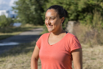 latin woman wearing hearing aids on the street