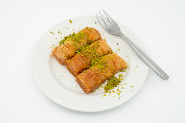 three slices of Turkish baklava on a white plate, close up