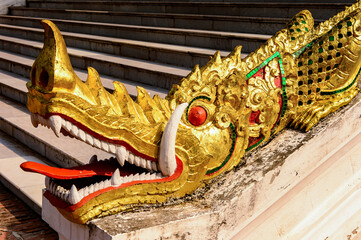 It's Golden dragon statue in the Haw Pha Bang Buddha temple of the National museum complex of Luang...