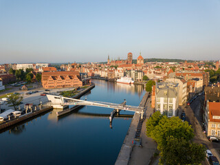 Fototapeta na wymiar View of the footbridge and the canal in Gdansk