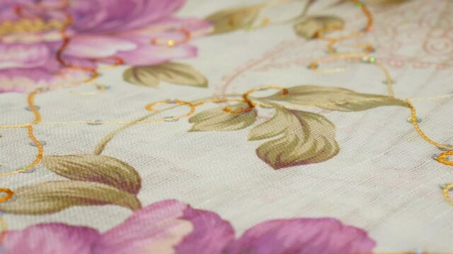 Details of silk fabric with floral print. texture background.