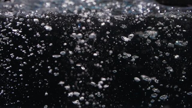 Tons of Slow Motion Rocks Sink in Water with Bubbles Drop
