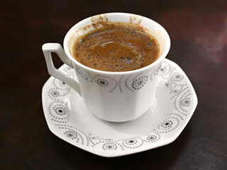 Cup of Turkish coffee on wooden table