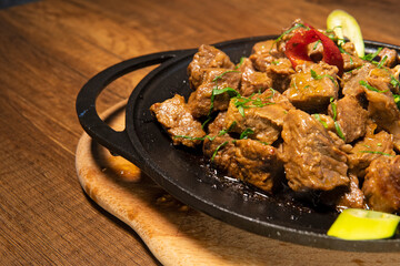 Meat Saute Turkish Et sote with wooden table