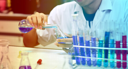 Fototapeta premium Chemists are researching, studying and development to find new compounds that are resistant to viruses. to find chemicals to resist viruses In the Chemical laboratory, Thailand. Selective Focus.