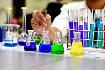 Chemists are researching, studying and development to find new compounds that are resistant to viruses.
to find chemicals to resist viruses In the Chemical laboratory, Thailand. Selective Focus.