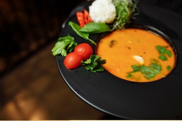 Tasty Tom Yum soup with shrimps and coconut milk