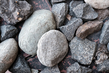 many grey stones closeup. Textures of stone 