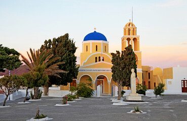 Fototapeta na wymiar A blue-domed church in Oia, Santorini, Greece.