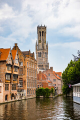 Fototapeta na wymiar It's Belfry from the Rozenhoedkaai, Historic Centre of Bruges, Belgium. part of the UNESCO World Heritage site