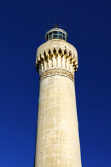 Fototapeta na wymiar El Hank Lighthouse constructed in 1916, 50 m tall, abandoned facility. - Casablanca, Morocco, taken in Dec 2019.