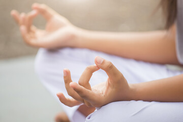  woman enjoying meditation and yoga in the park